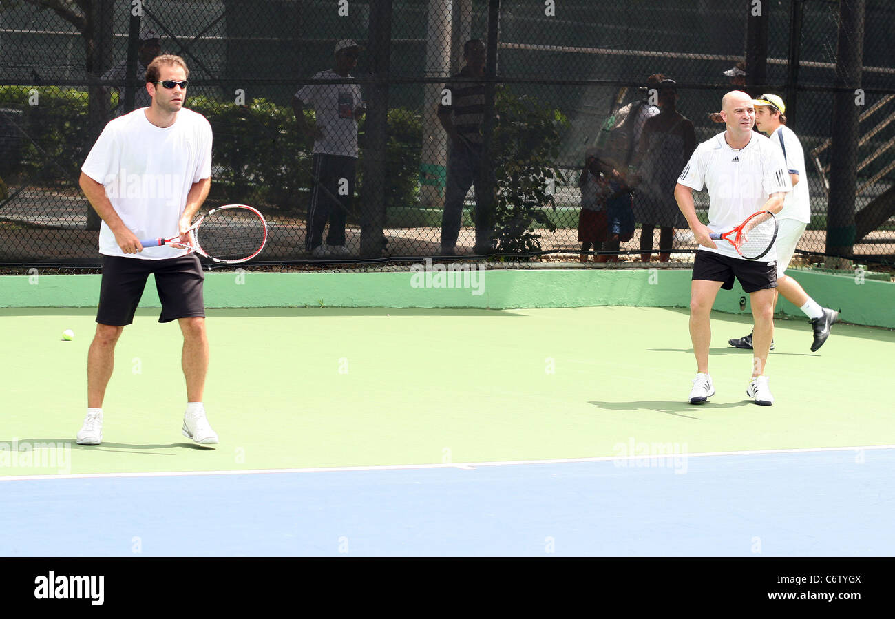 Tennis pros Andre Agassi and Pete Sampras open a free Tennis Clinic to encourage young children to get into the game San Juan, Stock Photo