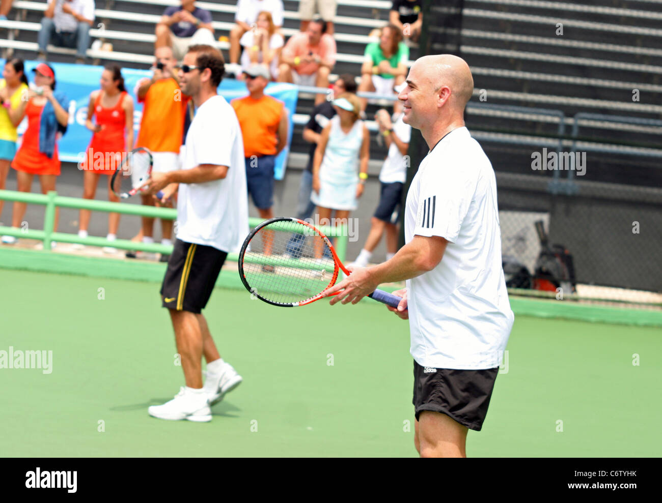 Tennis pros Andre Agassi and Pete Sampras open a free Tennis Clinic to encourage young children to get into the game San Juan, Stock Photo