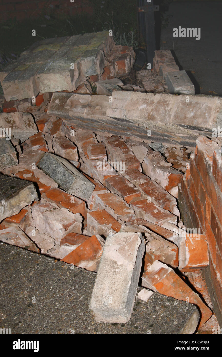 brick wall after being knocked down by car Stock Photo