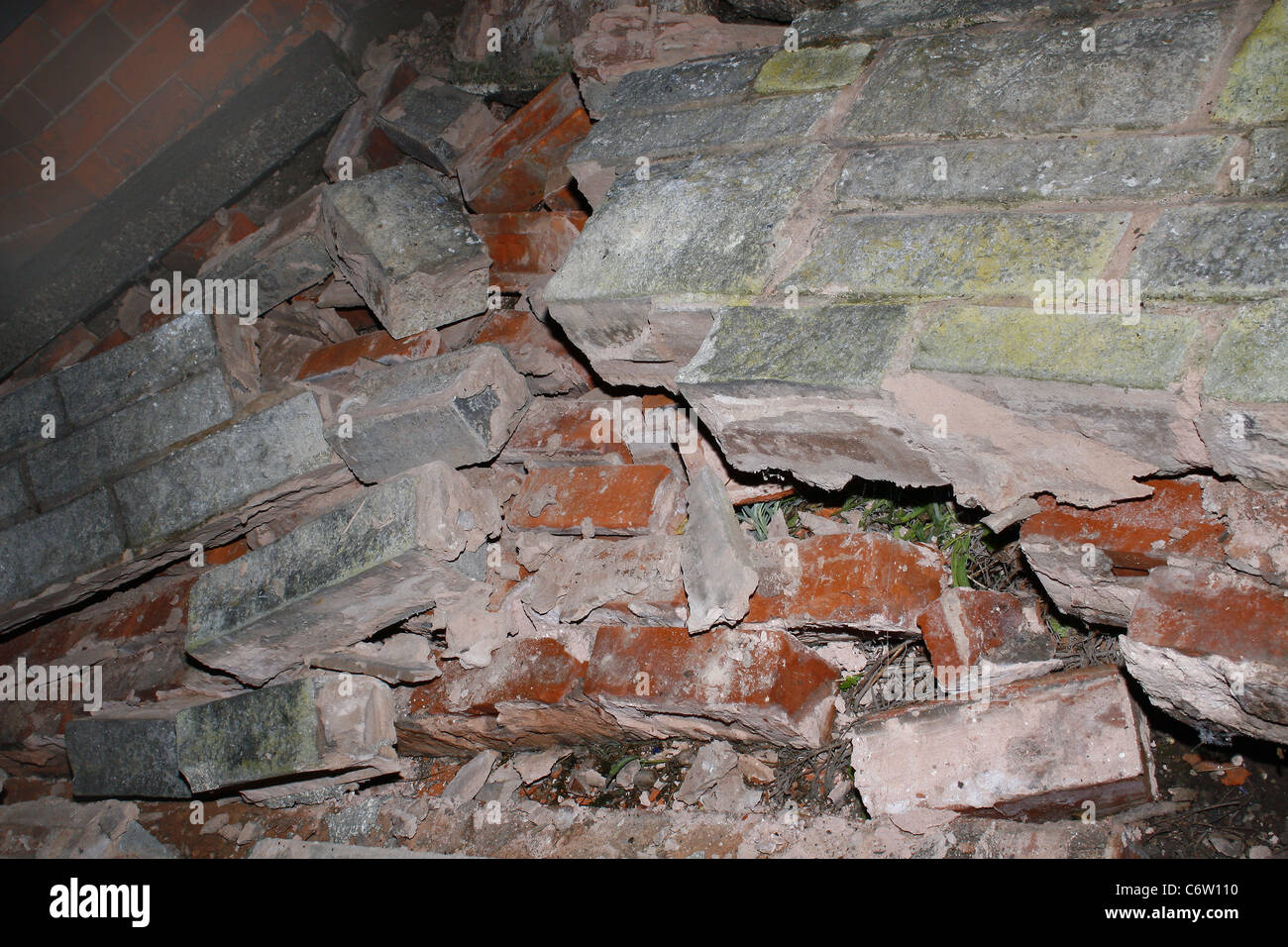 brick wall after being knocked down by car Stock Photo