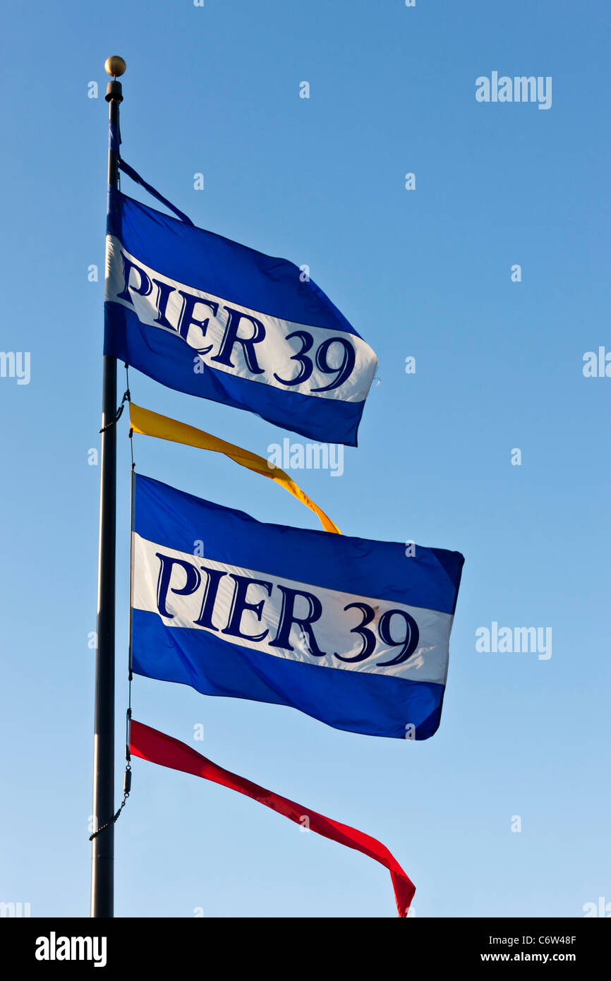 Flags flying at San Francisco's Pier 39 Fisherman's Wharf, California, USA. JMH5186 Stock Photo