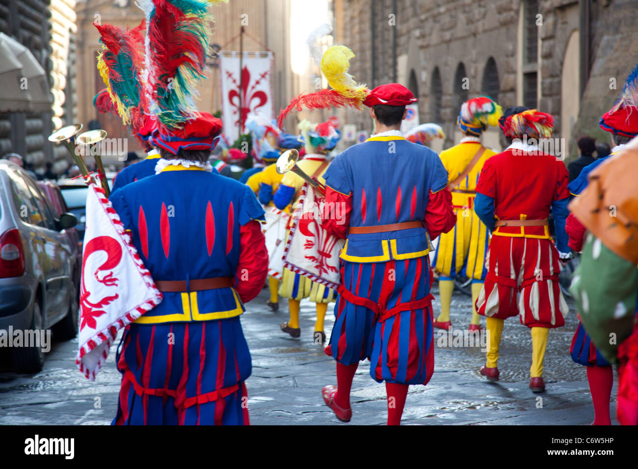 Parade by men in traditional costume through the streets of Florence