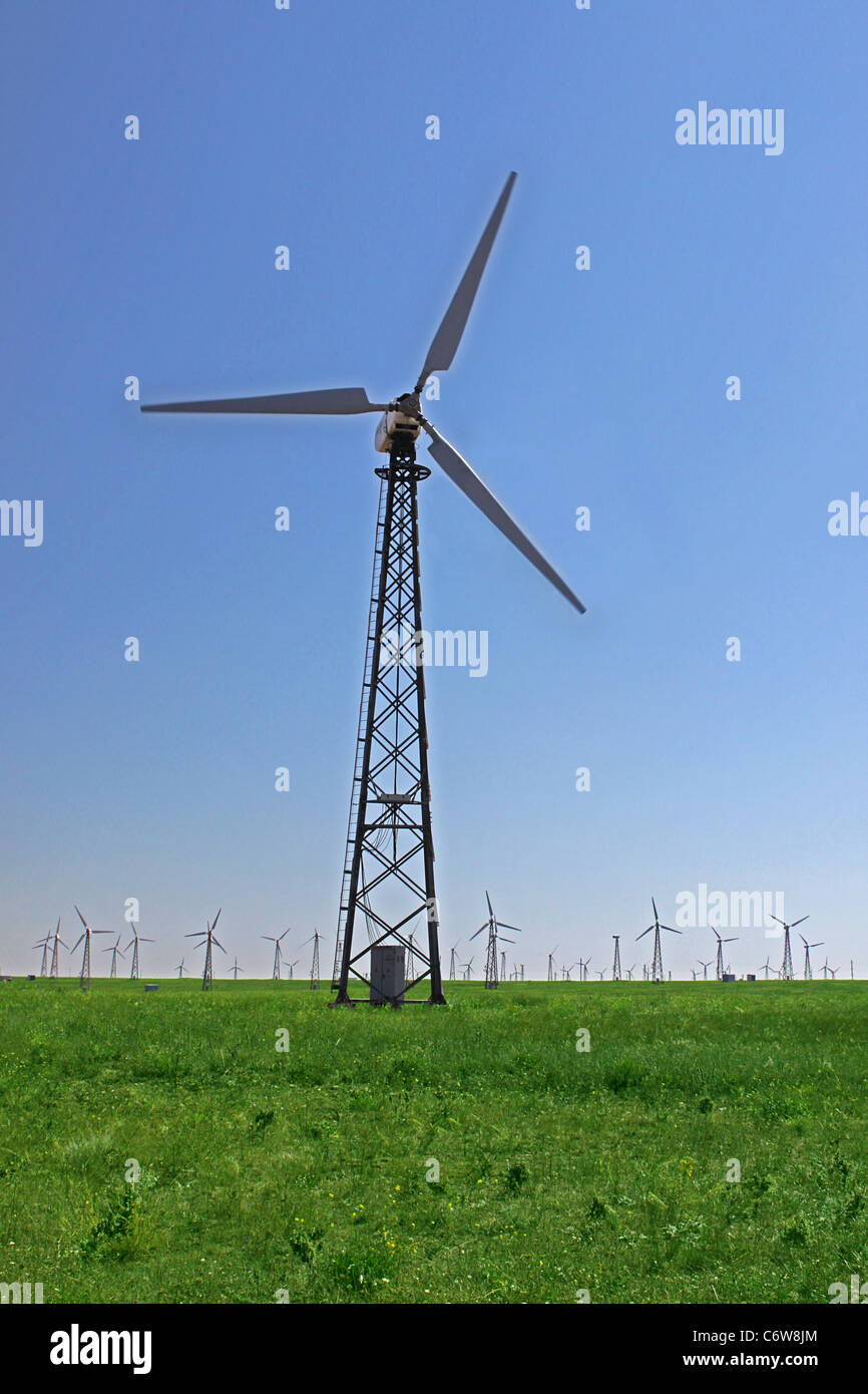 wind turbine over blue sky Stock Photo - Alamy