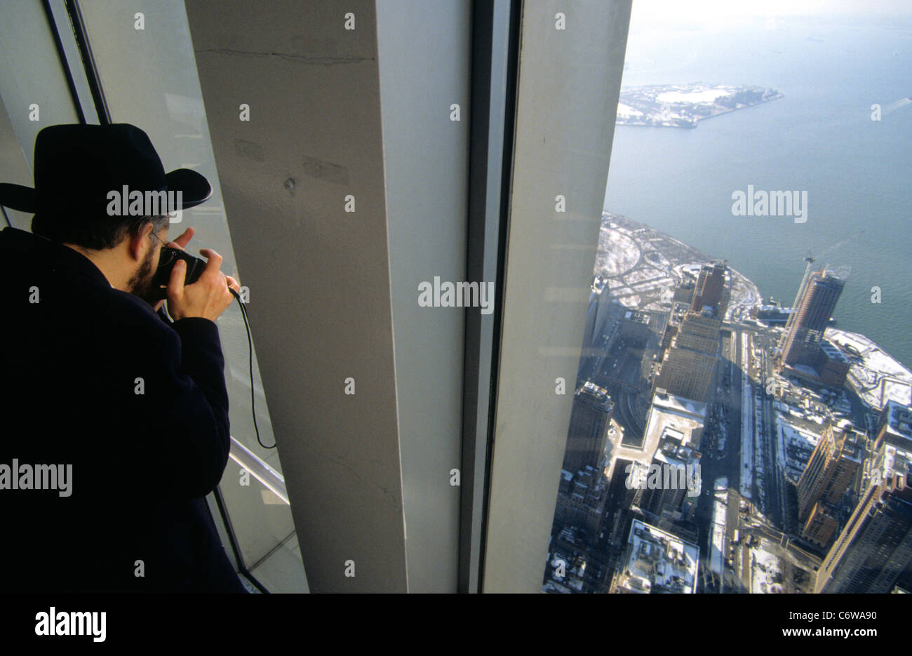 A Jewish man takes a photo from the top of the twin towers of the world trade centre, New York , USA.  2000. Stock Photo