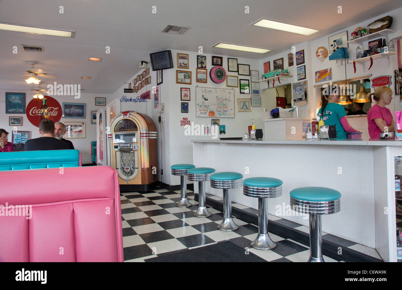Interior of Mr D'z Diner, Kingman, Arizona, with bar stools and waitresses. Stock Photo