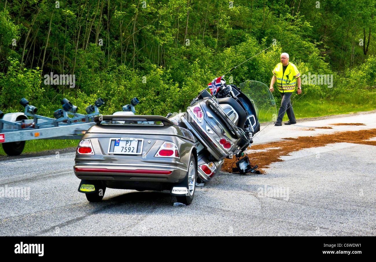 A motorbike and trailer accident on a road out of Flekkefjord, Vest-Agder, Norway. Stock Photo