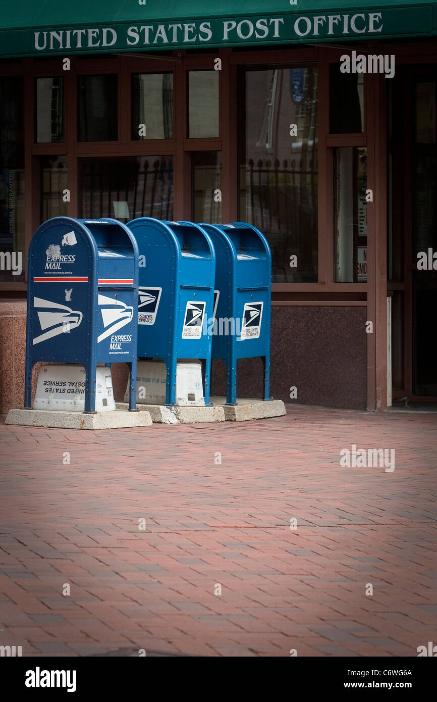 USPS mailboxes are pictured in front of a United States Post Office in