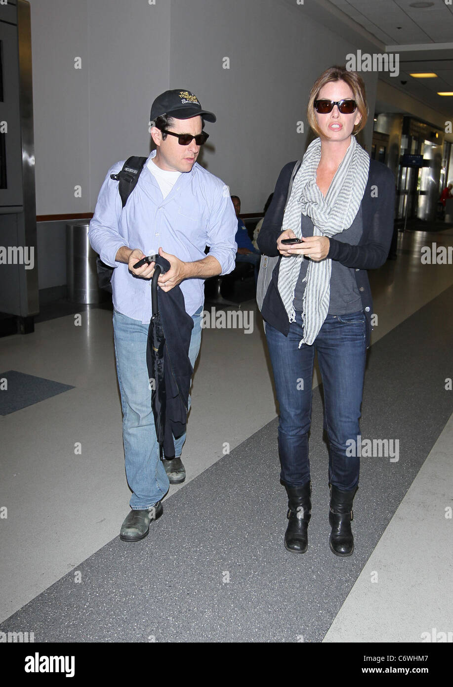 J.J. Abrams and his wife Katie McGrath arrives on a flight into LAX