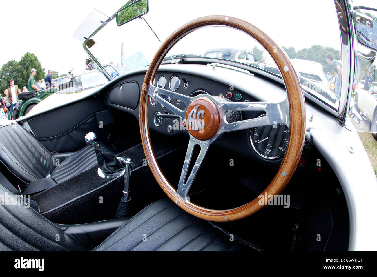 Classics on the Common Harpenden 2011 AC cockpit wood rim steering wheel leather trim interior classic car motor show Stock Photo