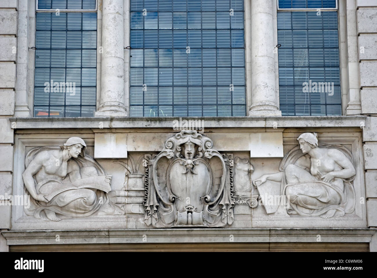 allegorical sculpture by  f e e schenck on frontage of the 1905 hammersmith central library, hammersmith, london, england Stock Photo