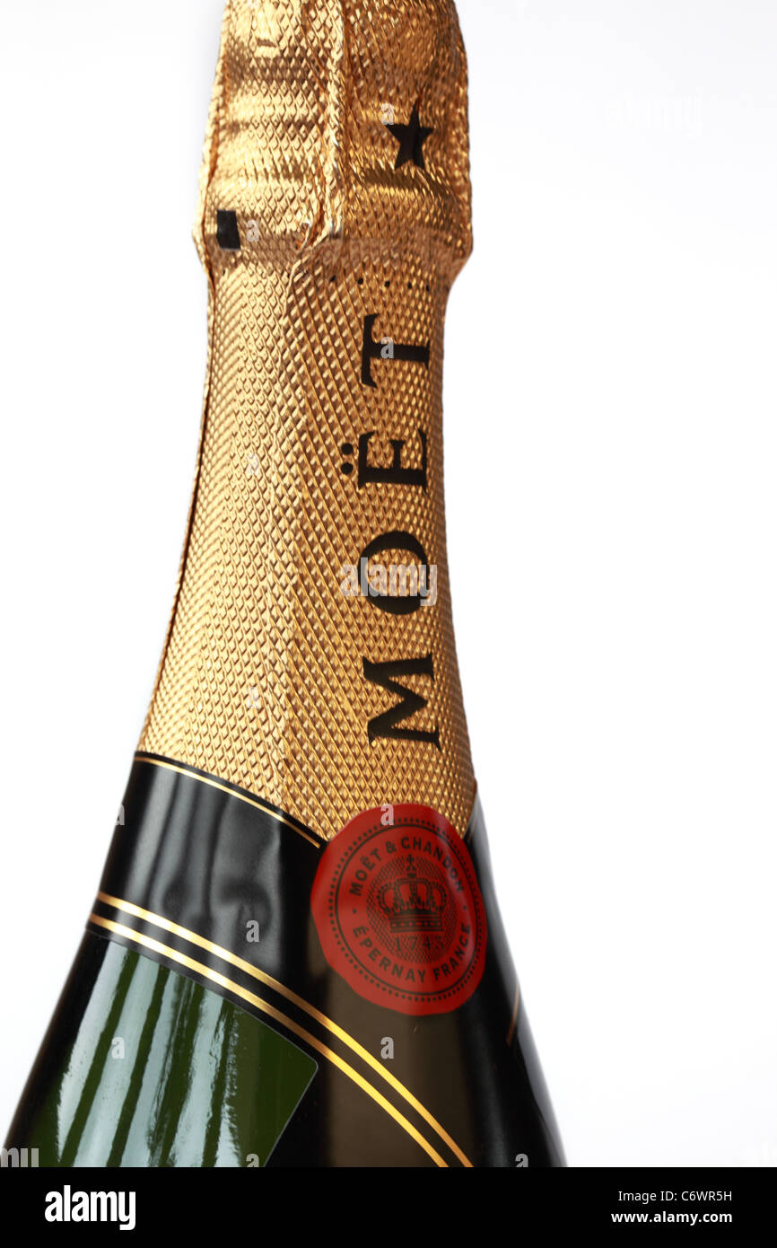 Close up of the top gold foil of an unopened bottle of Moet & Chandon Champagne Stock Photo
