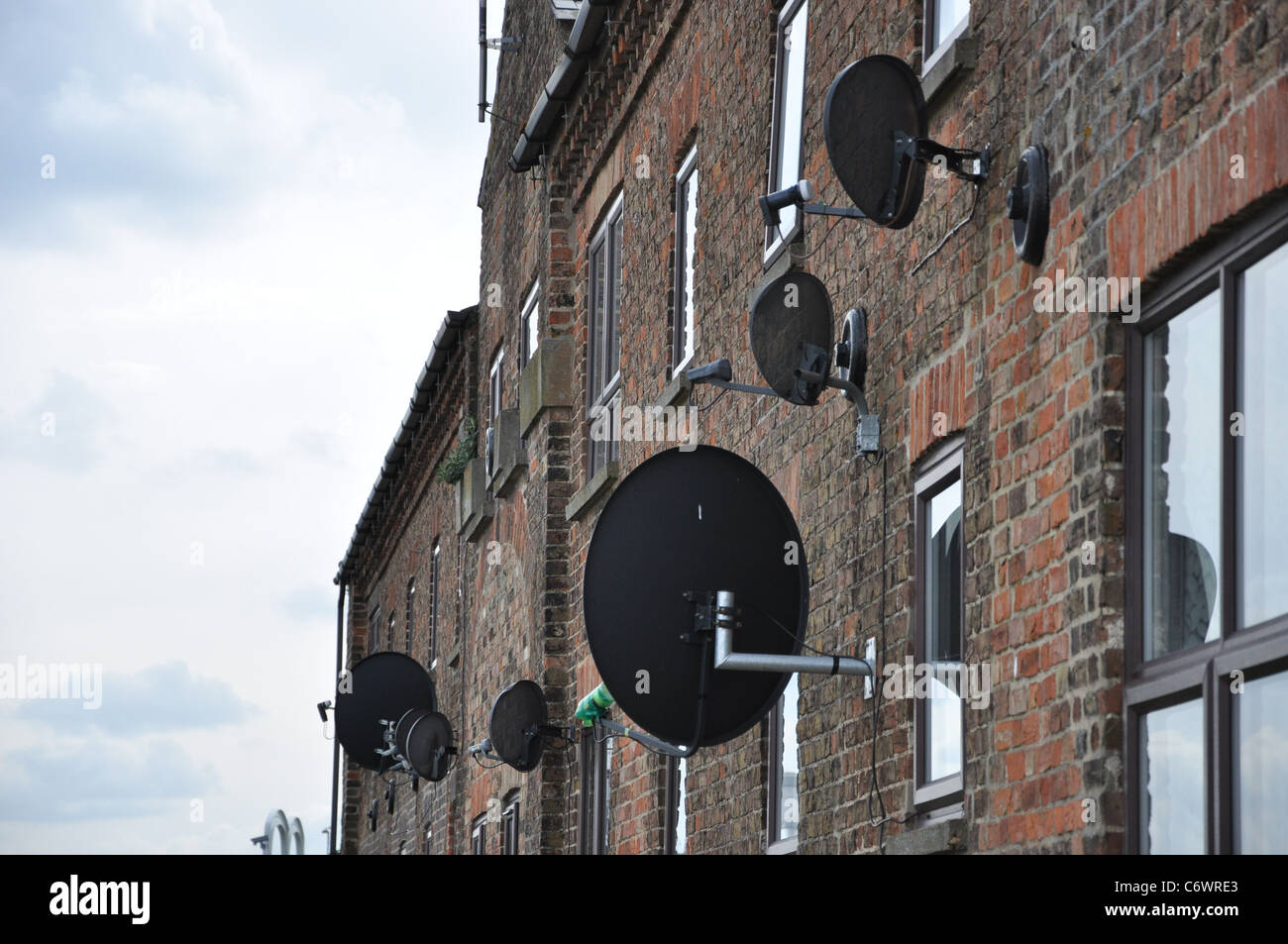 Satellite dishes on converted warehouse Stock Photo Alamy