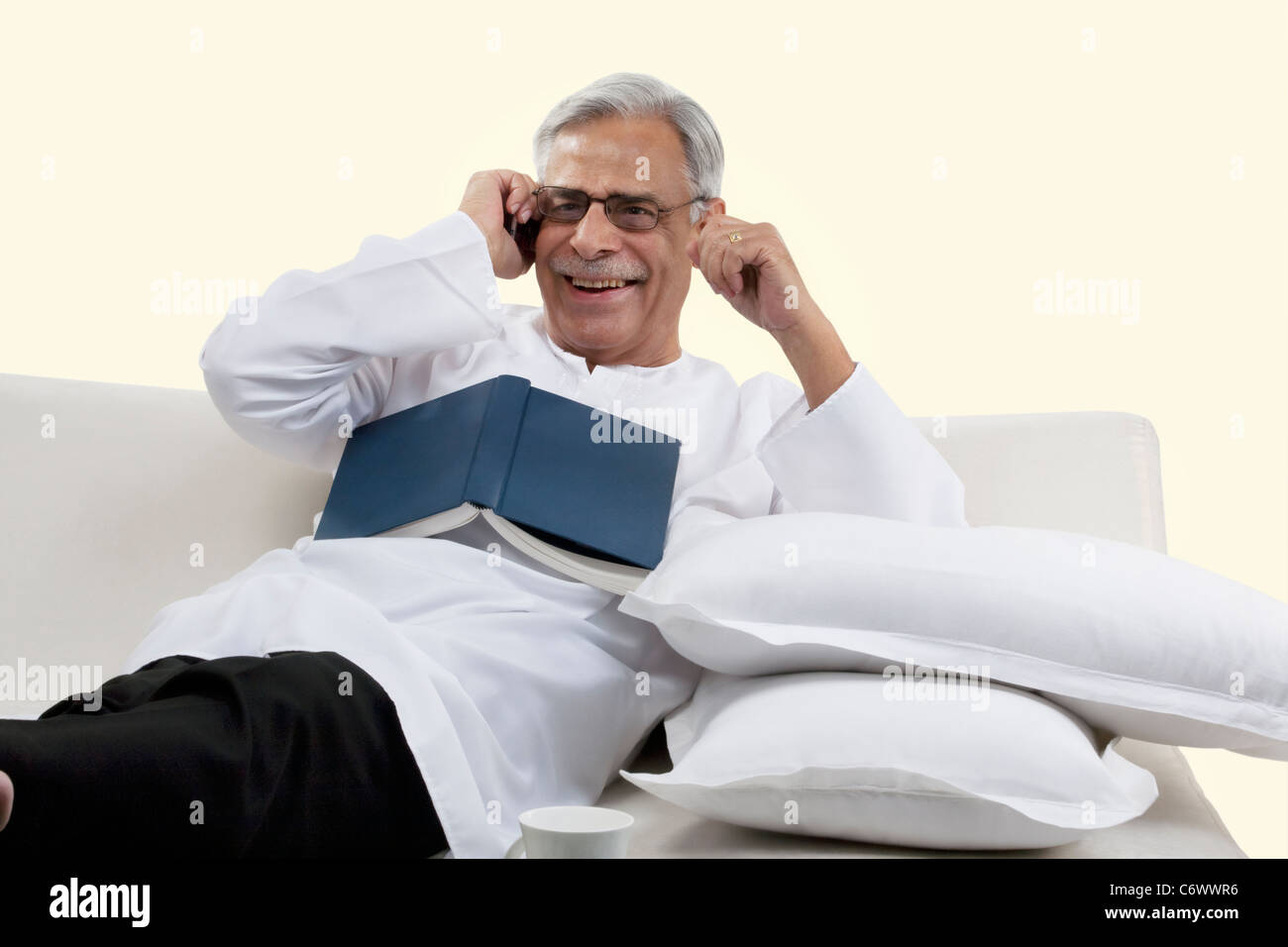 Old man talking on a mobile phone Stock Photo