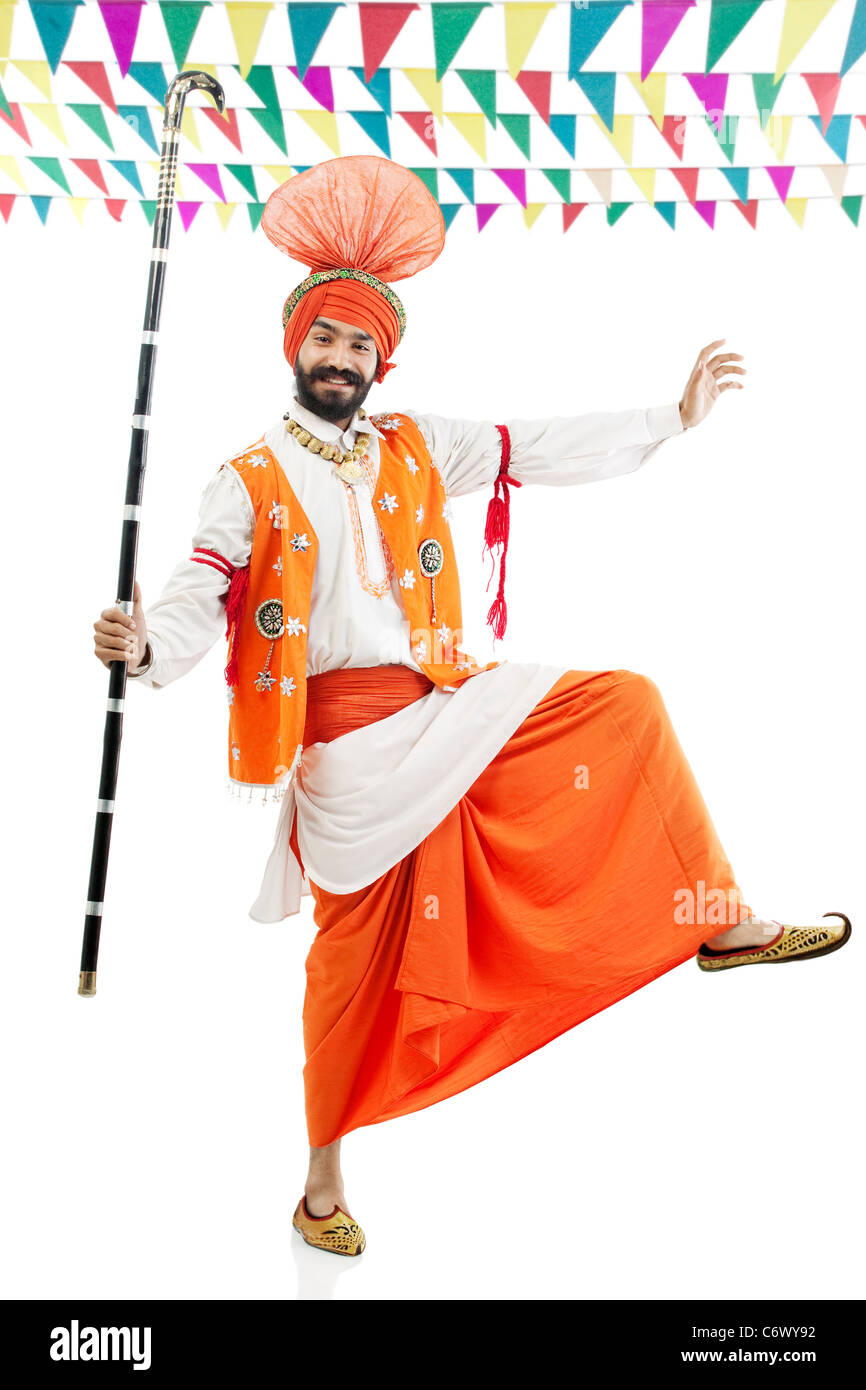 Sikh man posing with Khundis Stock Photo