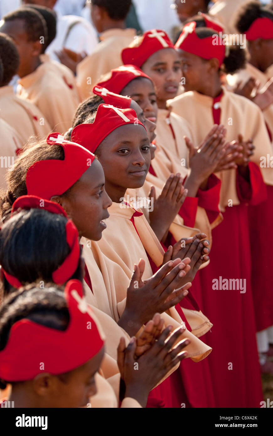 Christian Orthodox devotees standing in line and singing at the Timket ...