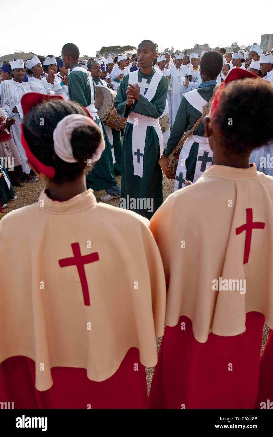 Christian Orthodox devotees standing in line and singing at the Timket ...