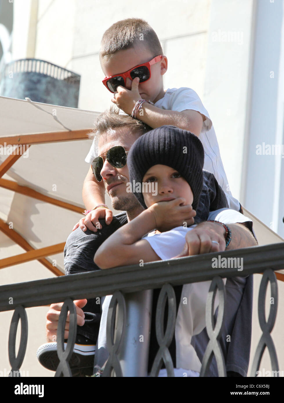 Cruz Beckham picks his nose while watching the Jonas Brothers perform