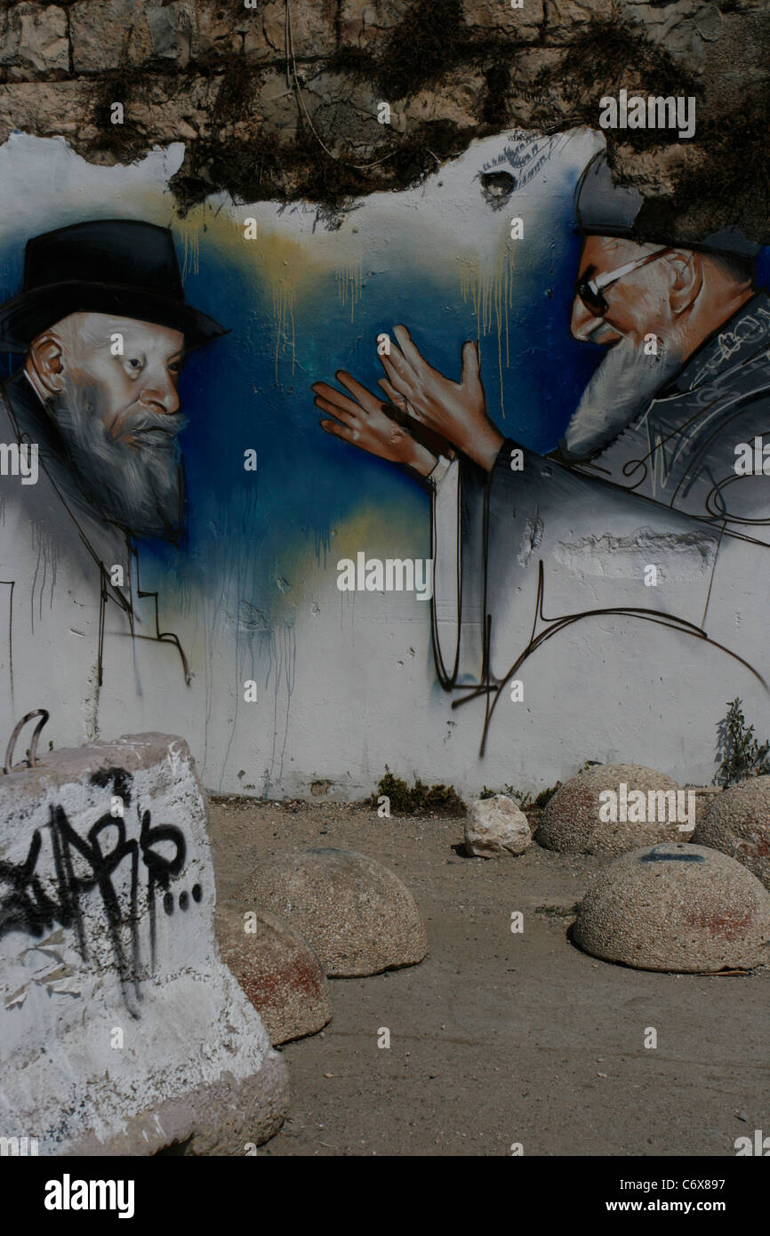 A wall painting in Hebron is showing an Jewish ultra-orthodox settler together with the prominent Chief Rabbi Yosef Ovadia. Stock Photo