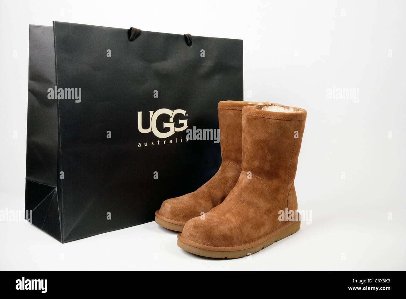 Ugg boots with original shopping bag Stock Photo - Alamy