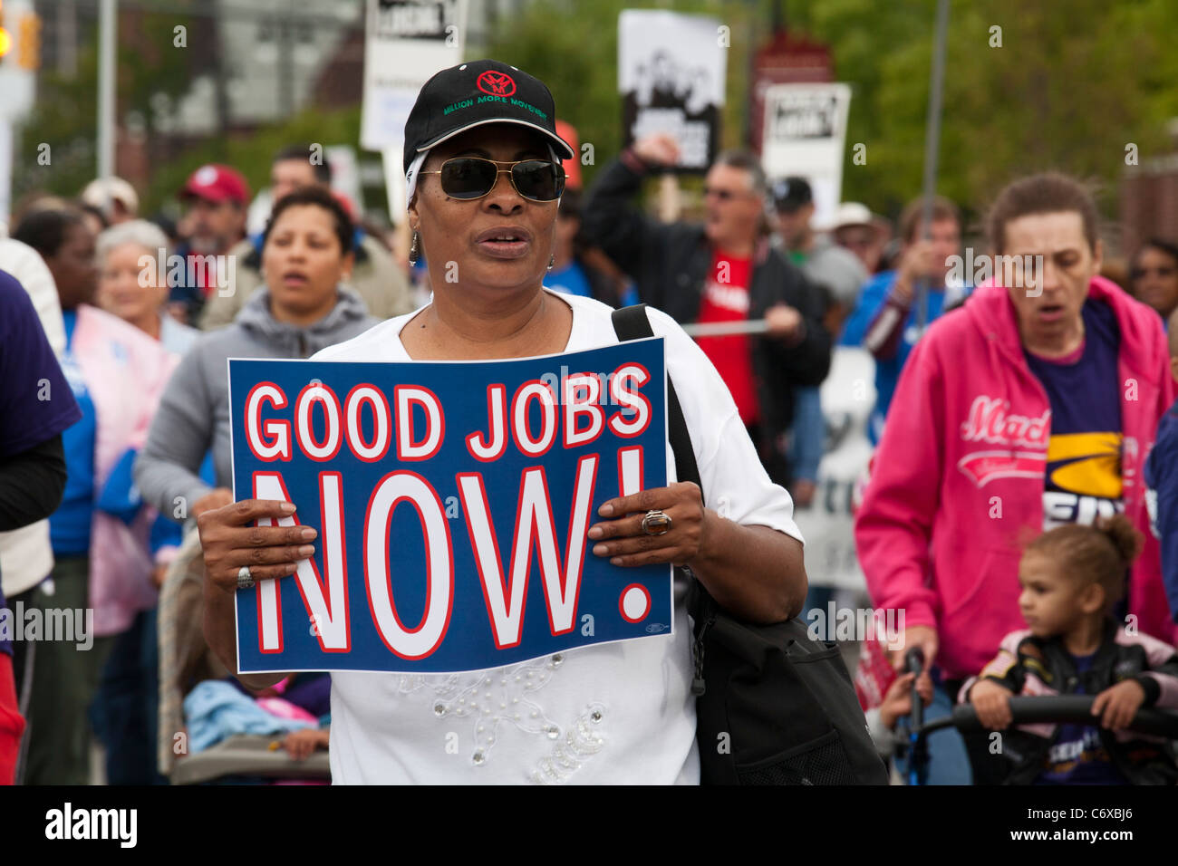 Detroit, Michigan - A woman holds a sign for 'Good Jobs Now' in the Labor Day parade. Stock Photo