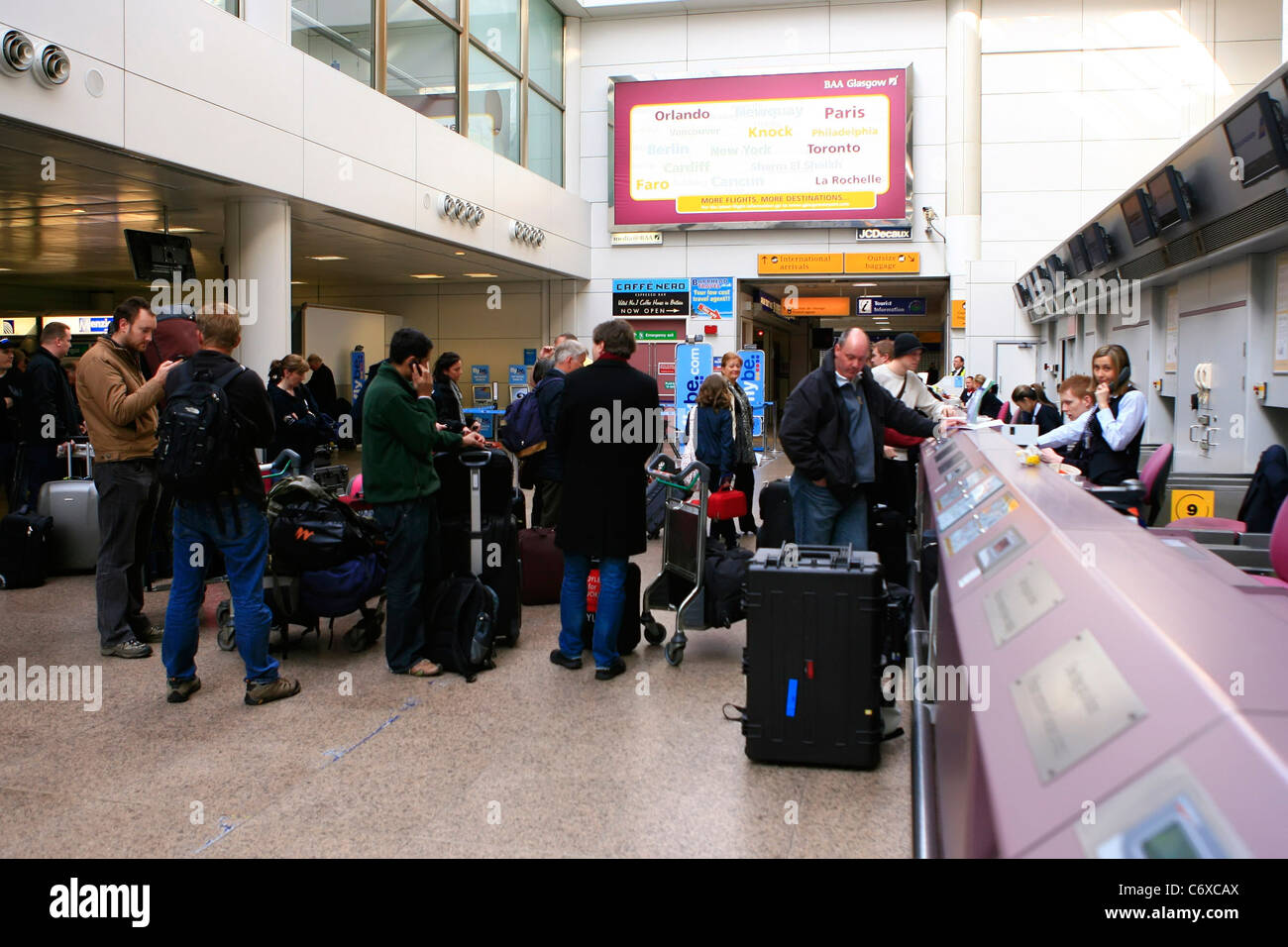 Passengers check in at Glasgow Airport on Tuesday, 20th April 2010. Some domestic planes have been allowed to fly in Scotland Stock Photo