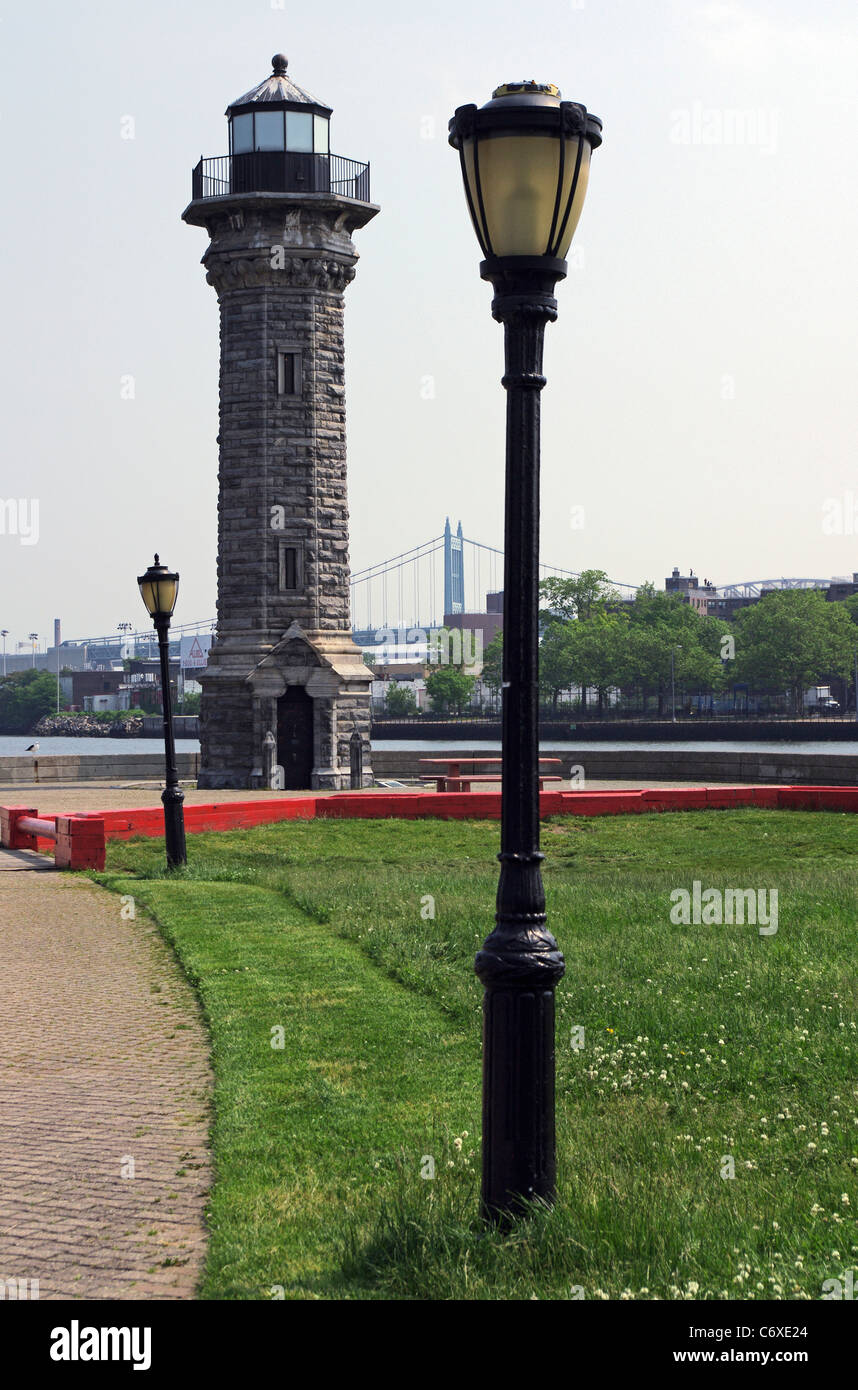 Gothic style stone Blackwell Lighthouse on northeast end of Roosevelt Island looking toward Astoria, Queens, NYC, USA Stock Photo
