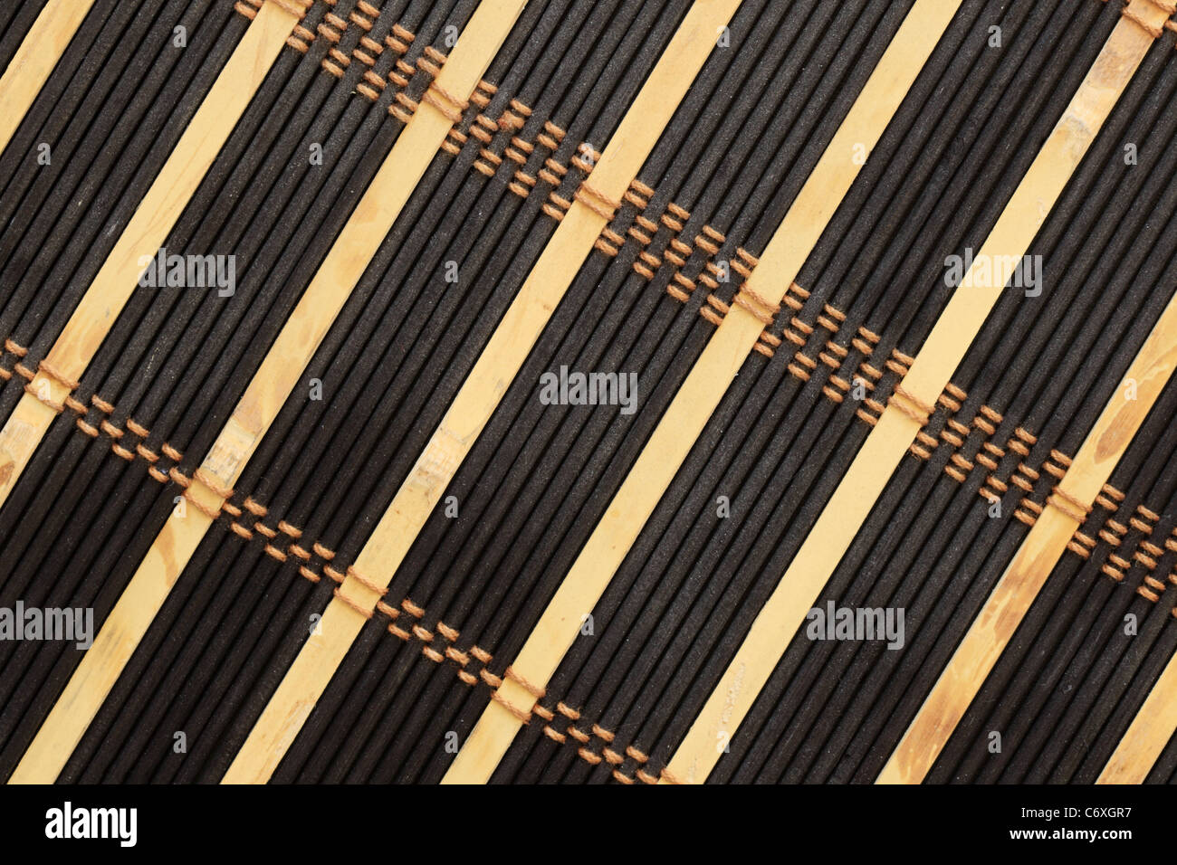 black and tan bamboo and string mat background Stock Photo