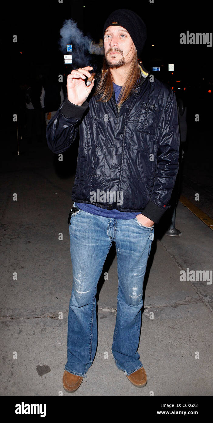 Kid Rock smokes a cigar as he leaves Trousdale night club Los Angeles,  California, USA - 20.04.10 Stock Photo