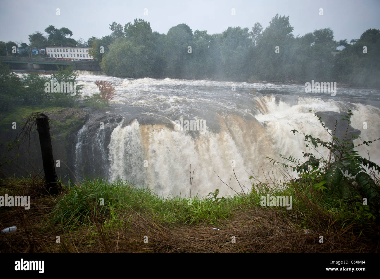 Thousands of gallons of water cascade over the Great Falls of the Passaic River in Paterson, NJ