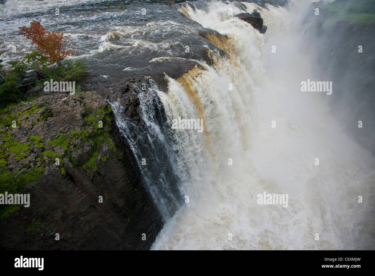 Thousands of gallons of water cascade over the Great Falls of the Passaic River in Paterson, NJ Stock Photo