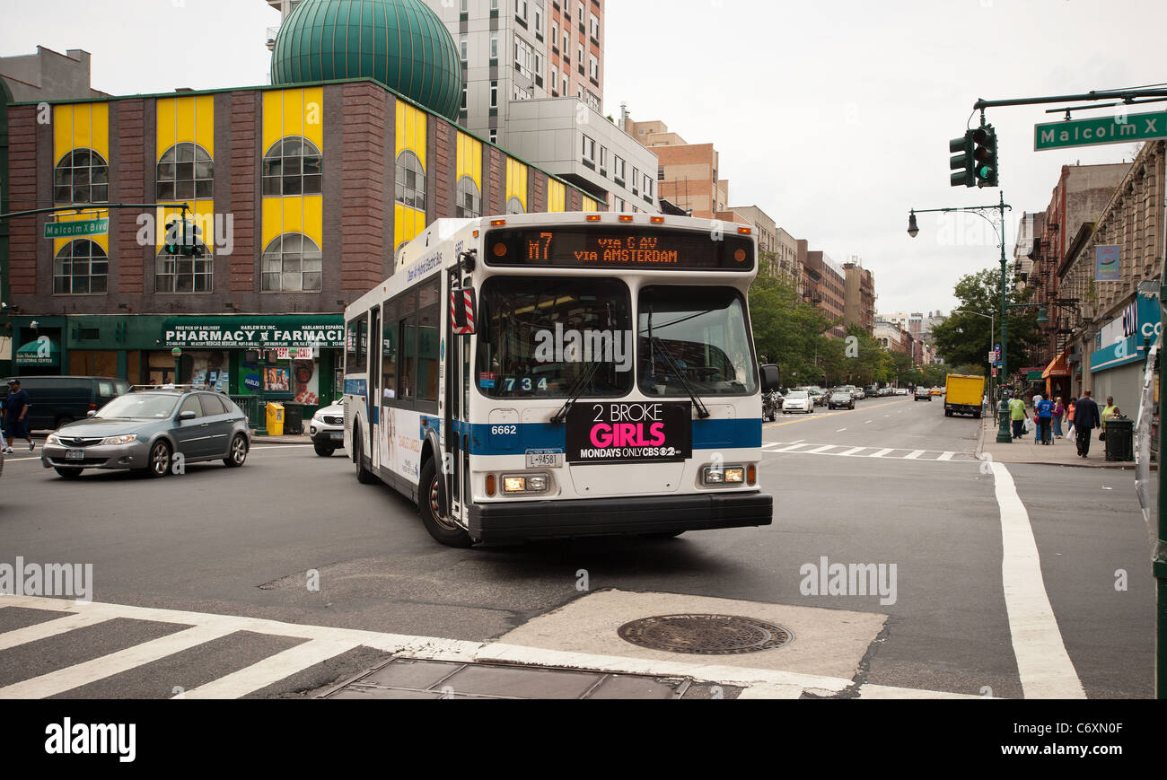 A New York City Transit Authority turns onto Malcolm X Blvd. (Lenox