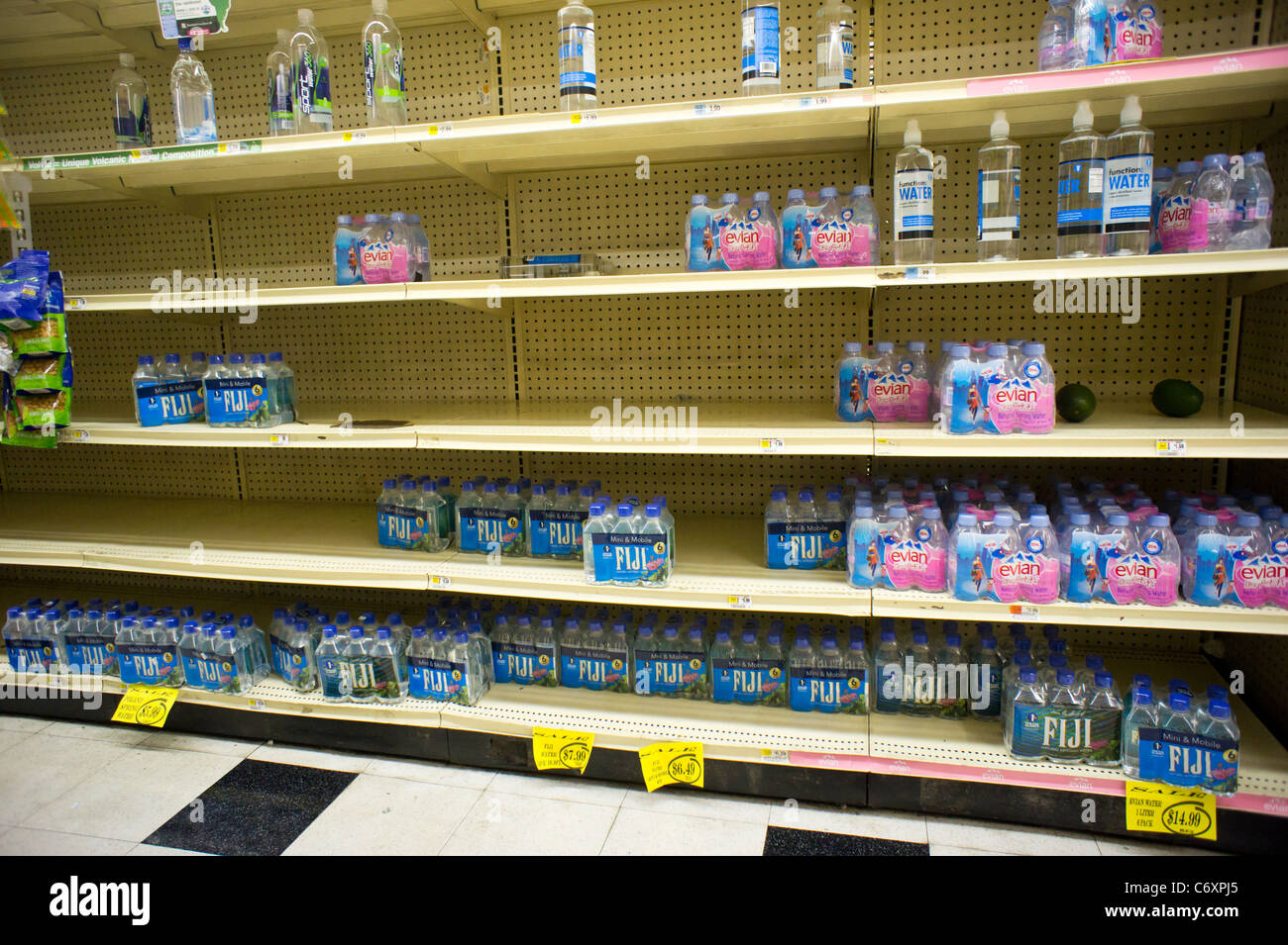 Shelves stripped bare of bottled water by customers stocking up for