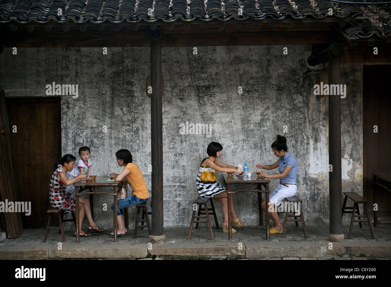 People have snacks at Huishan ancient town in Wuxi, Jiangsu, China. 2011 Stock Photo