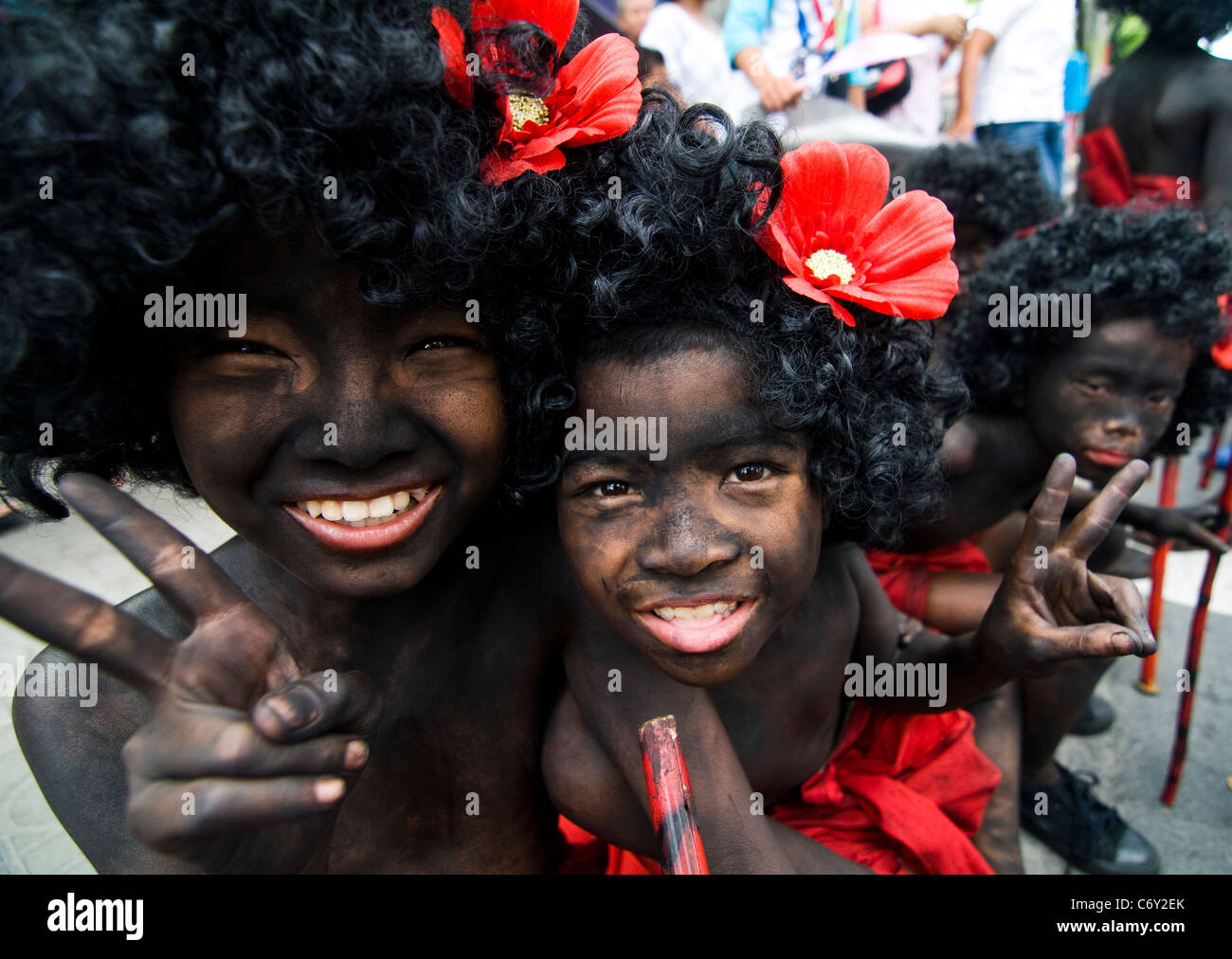 Afro Thai boys posing for a shot during a colorful festival. Stock Photo