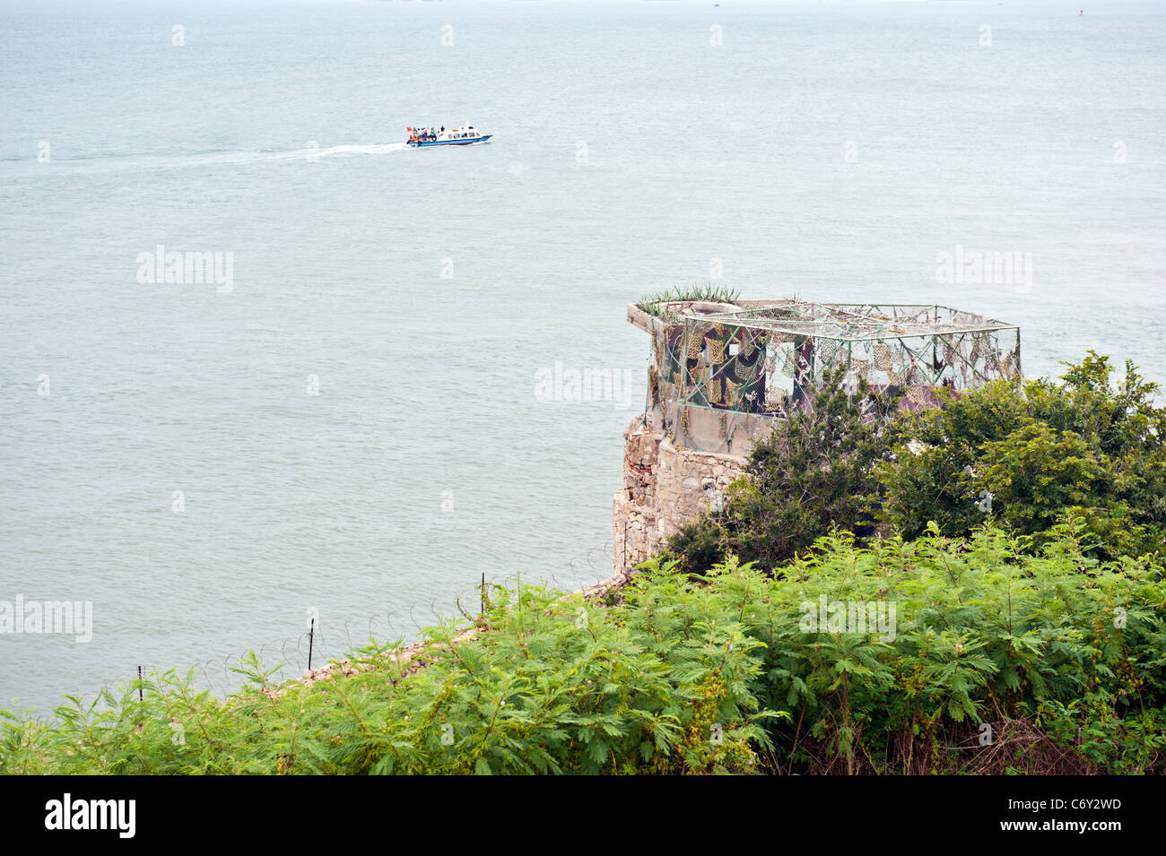 Mashan Observation Post and a boat from China with Chinese tourists, Kinmen, Taiwan Stock Photo