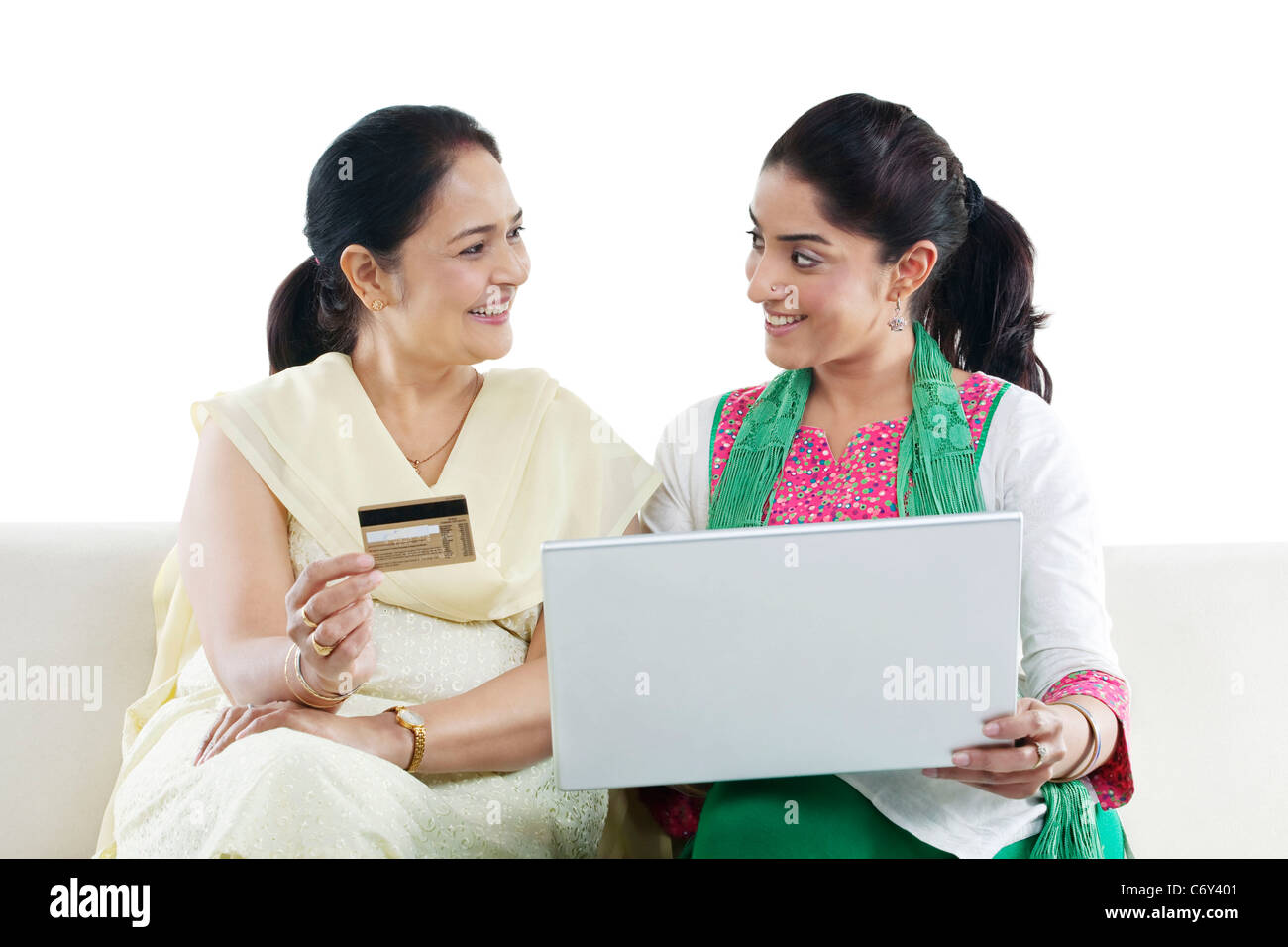 Mother and daughter with a laptop and credit card Stock Photo