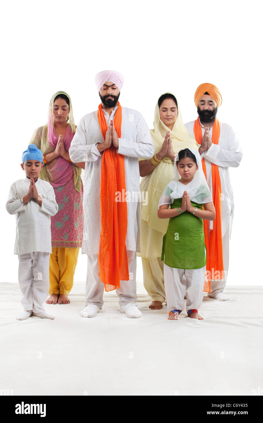 Sikh family praying Stock Photo