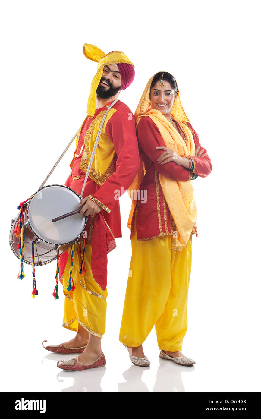 Sikh couple posing in traditional attire Stock Photo