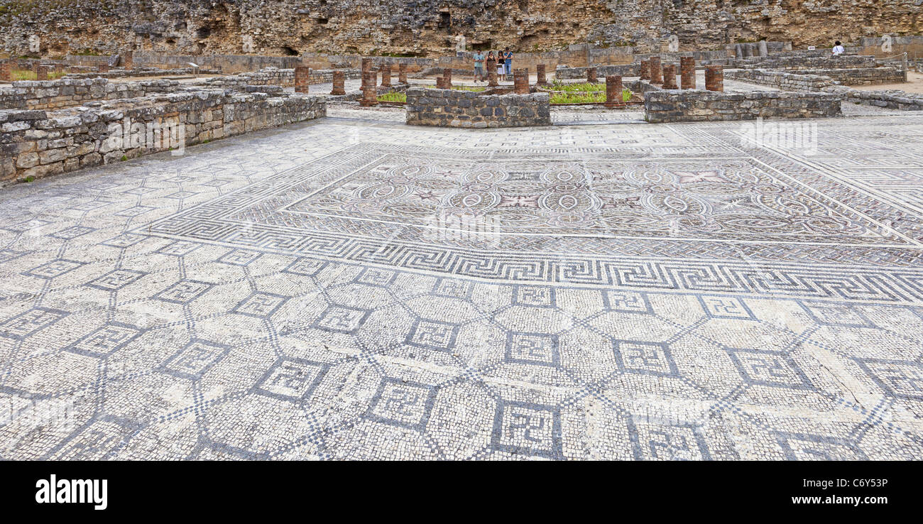 House of the Swastika Villa mosaics and Defensive Wall in Conimbriga, the best preserved Roman city ruins in Portugal. Stock Photo