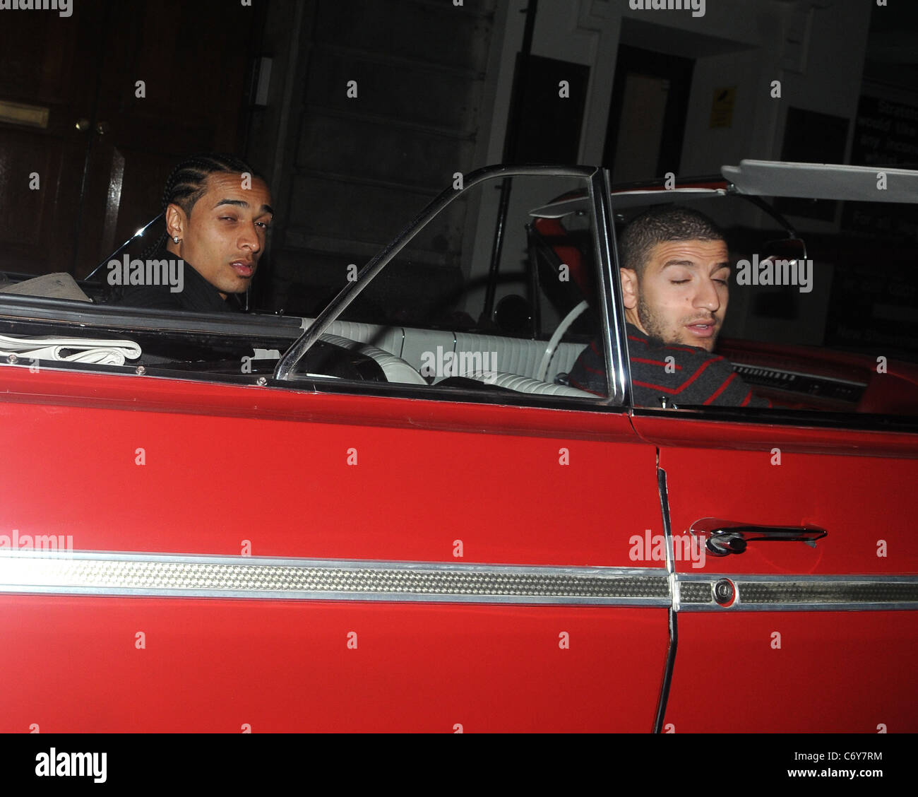 Benoit Assou-Ekotto and Adel Taarabt leave Funky Buddha club in a Chevrolet car London, England - 08.04.10 Stock Photo