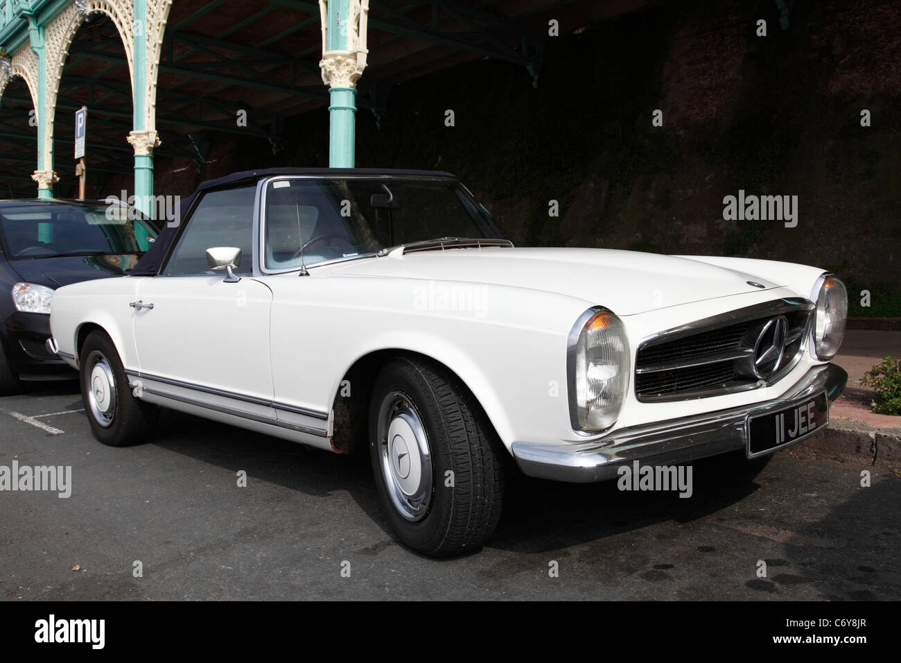 A Mercedes SL classic car parked on a U.K. street. Stock Photo