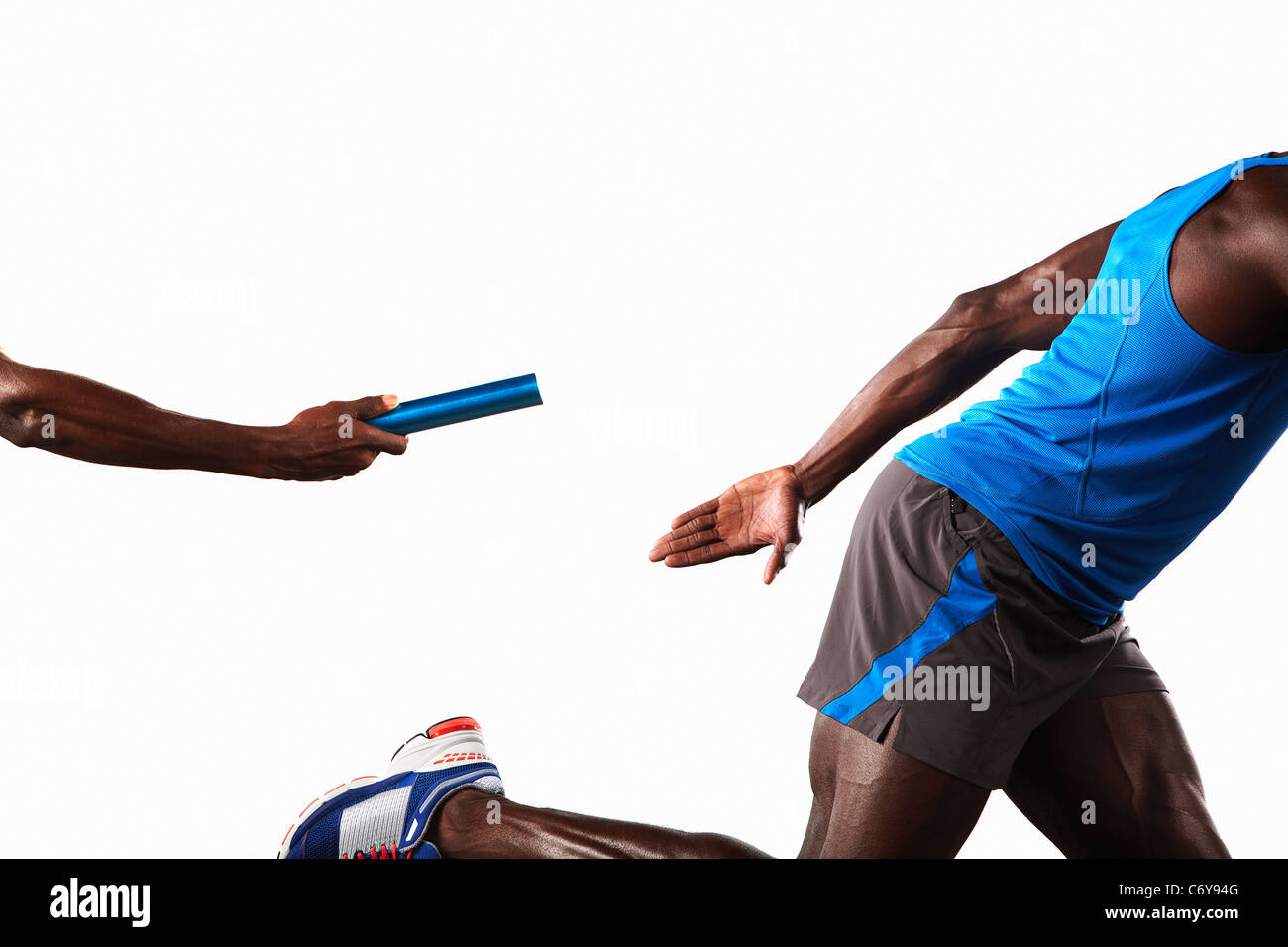 Athlete passing relay baton Stock Photo Alamy