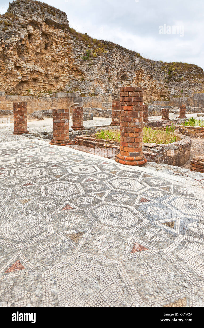 Peristyle, Mosaic and Town Wall. House of the Swastika Villa - Conimbriga, the best preserved Roman city ruins in Portugal. Stock Photo
