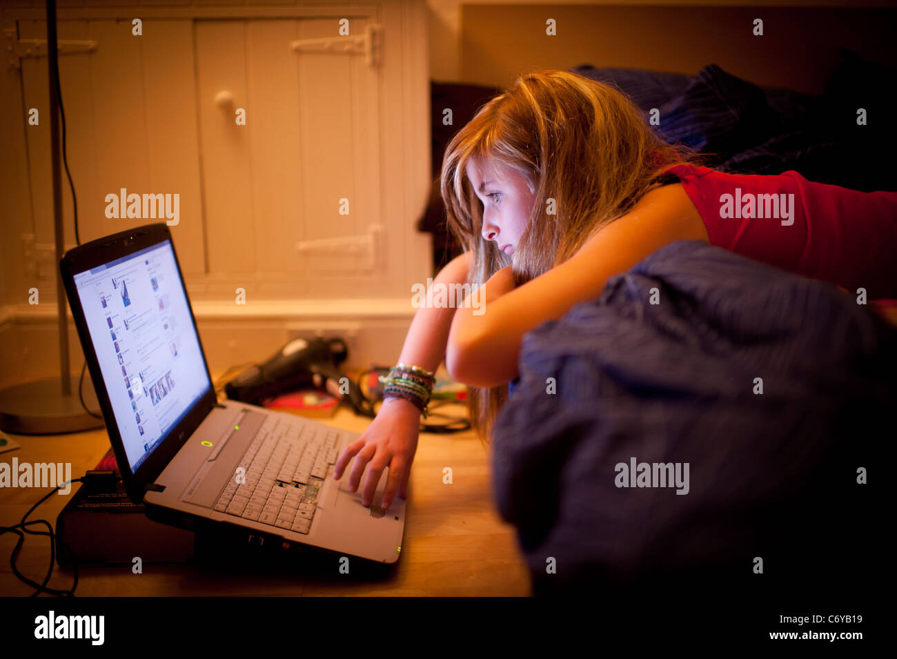 A 12 Twelve 13 Thirteen Year Old Teenage Girl On Bed In Her