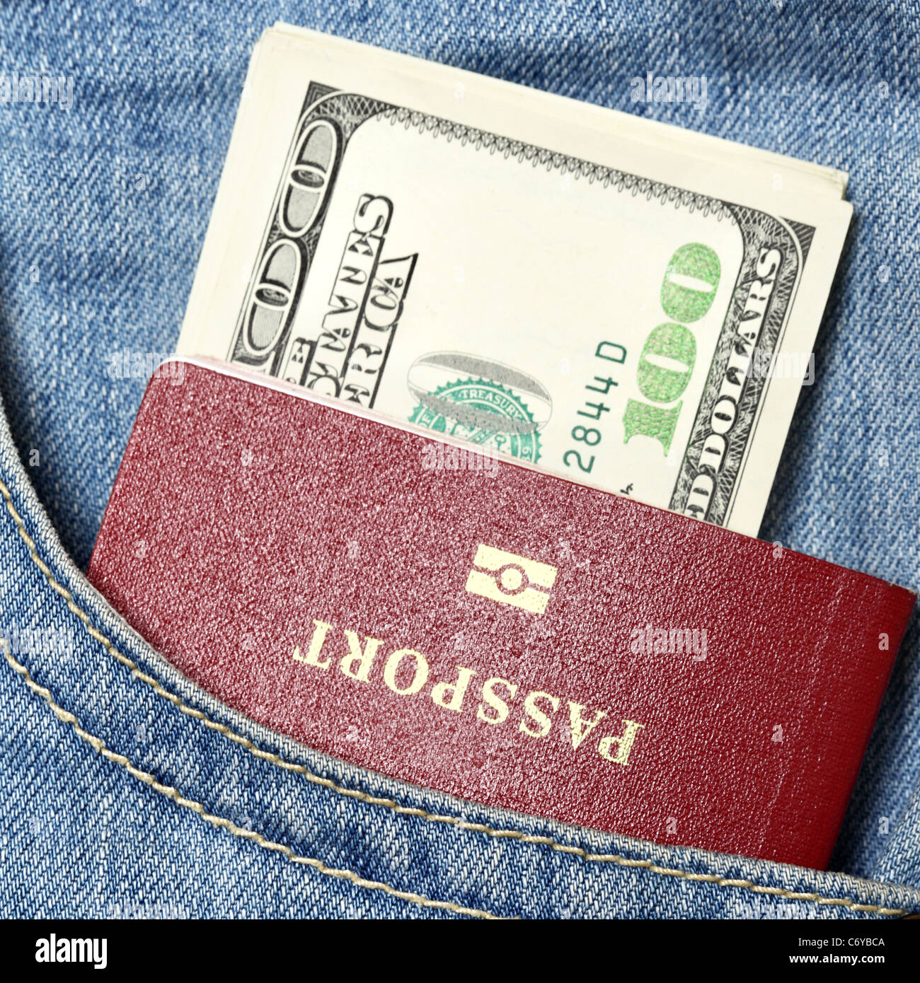 Passport and dollars in jeans pocket close-up Stock Photo
