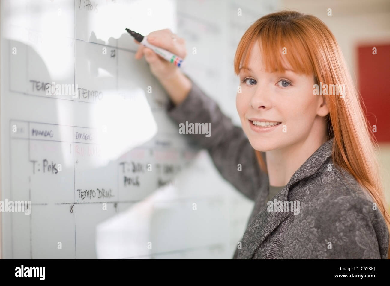 businesswoman-writing-on-calendar-stock-photo-alamy