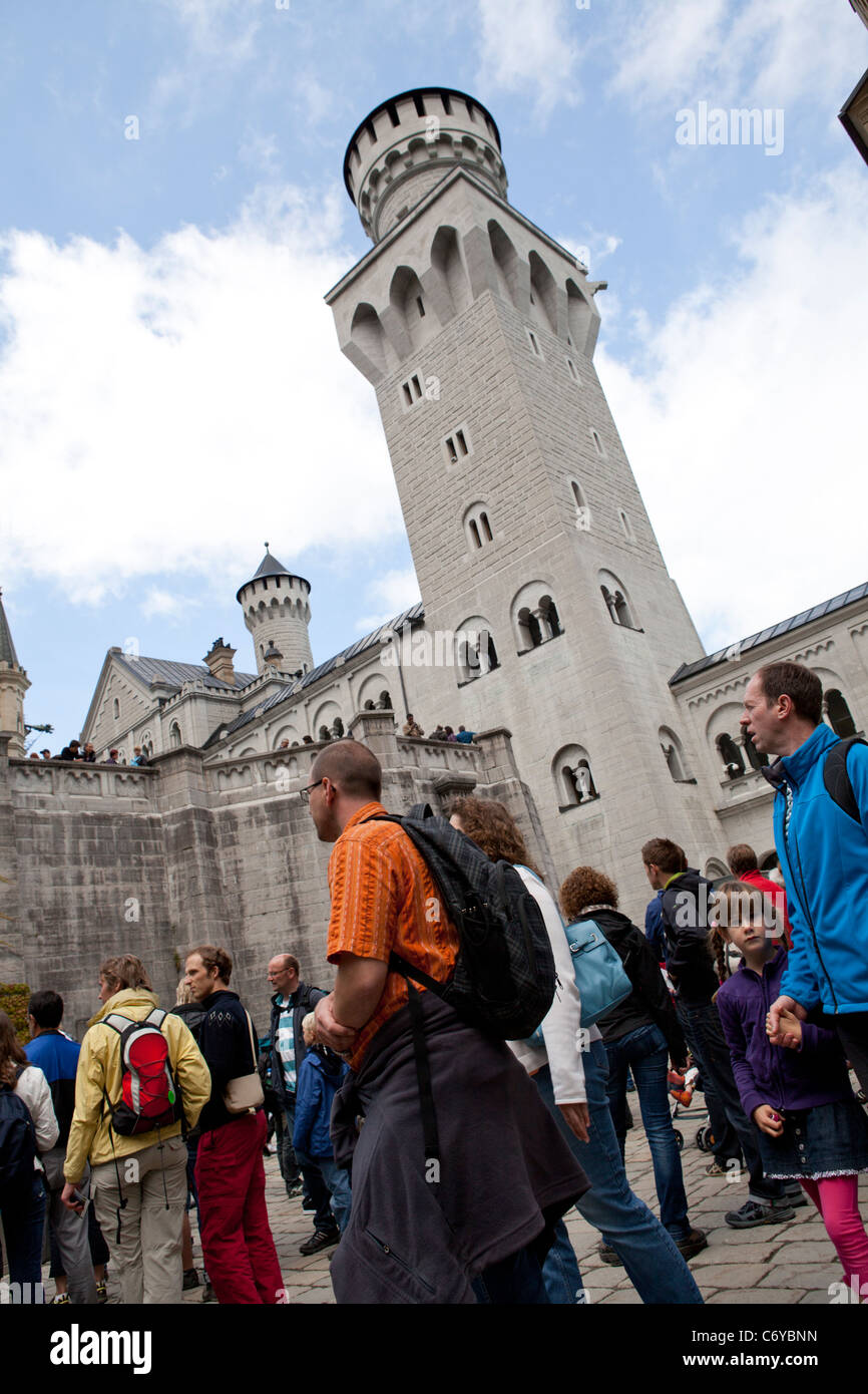 TOURISTS WAITING IN LINE FOR THEIR TURN TO VISIT THE CASTLE OF NEUSCHWANSTEIN IN BAYERN, GERMANY Stock Photo