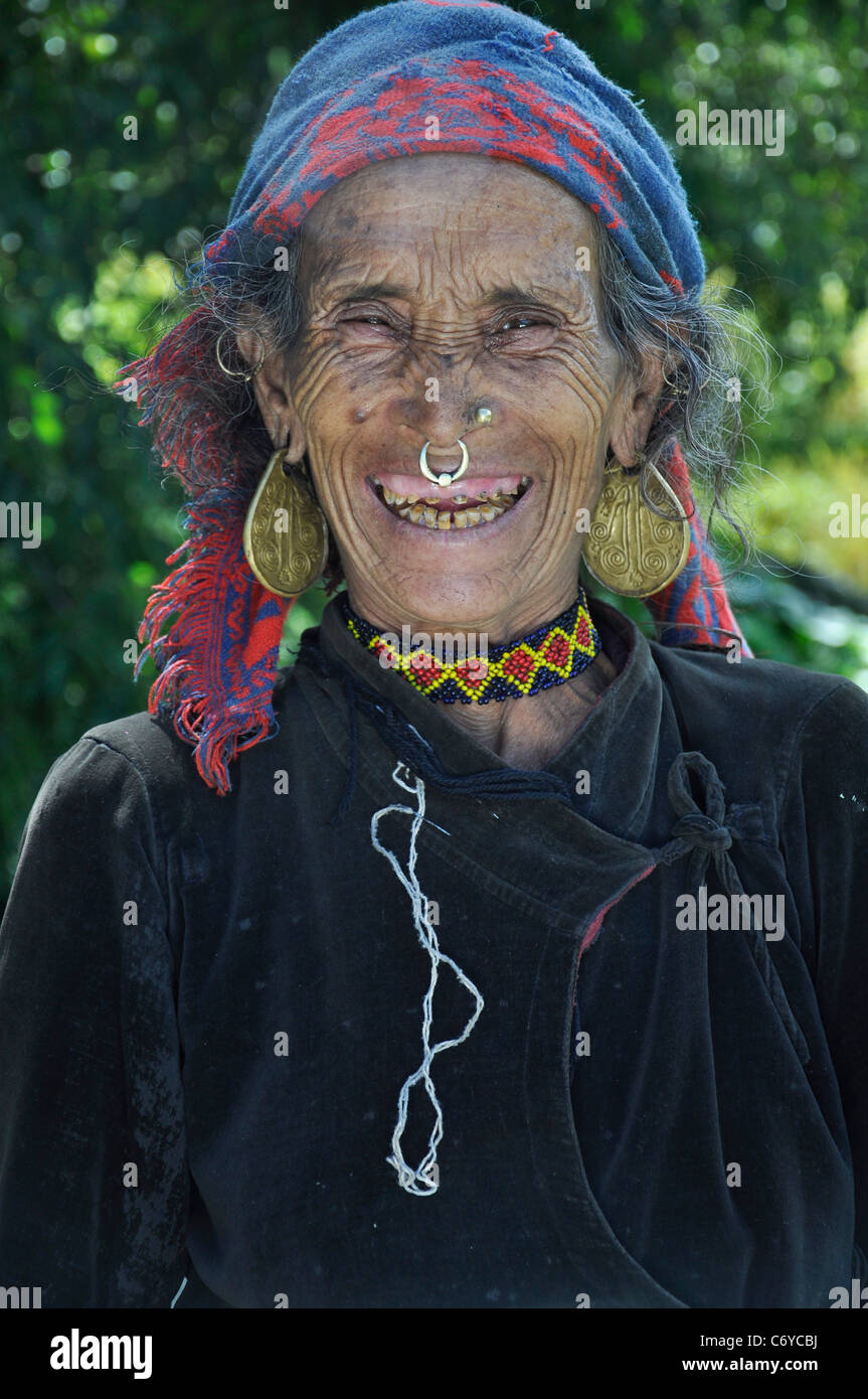 A Thakuri old woman smiling when her grand son asked about her your age and marriage in Danda Phaya village, Simikot, Humla. Stock Photo