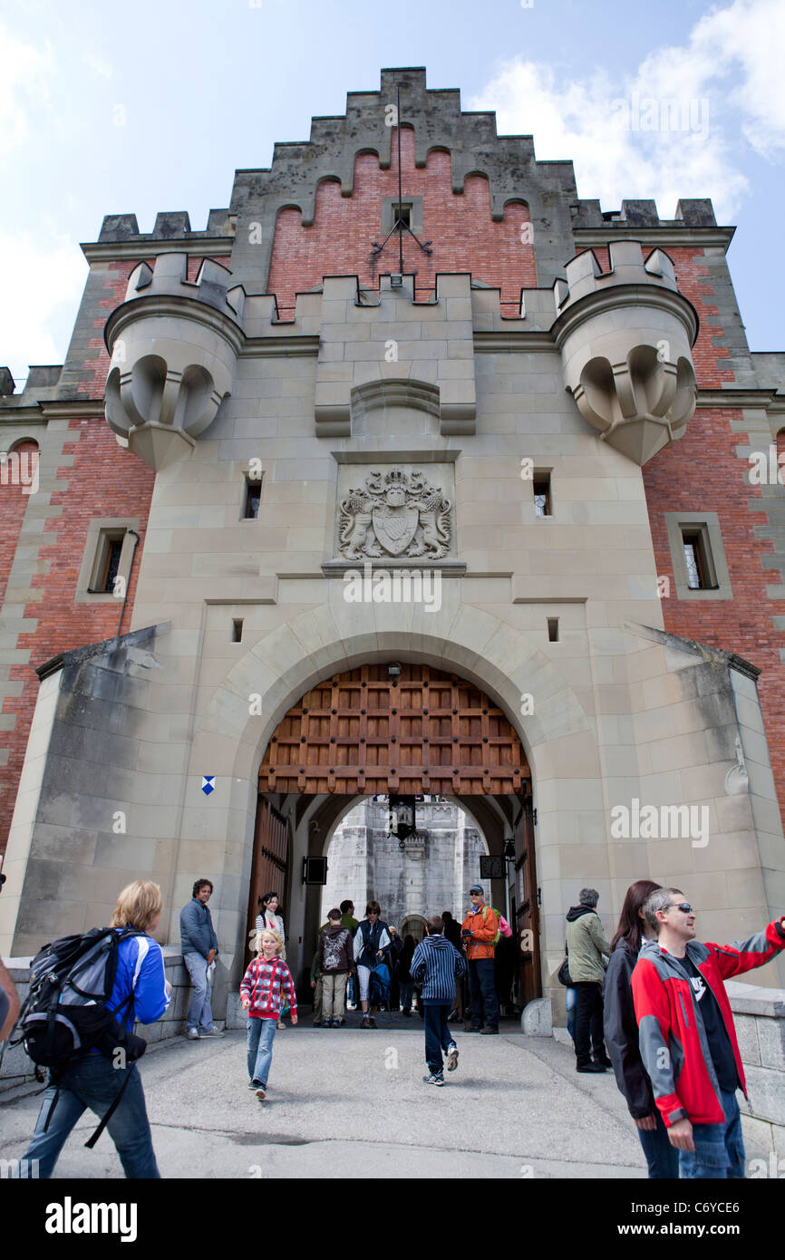 Tourists and visitors entering the Neuschwanstein castle gate, Bavaria, Germany Stock Photo