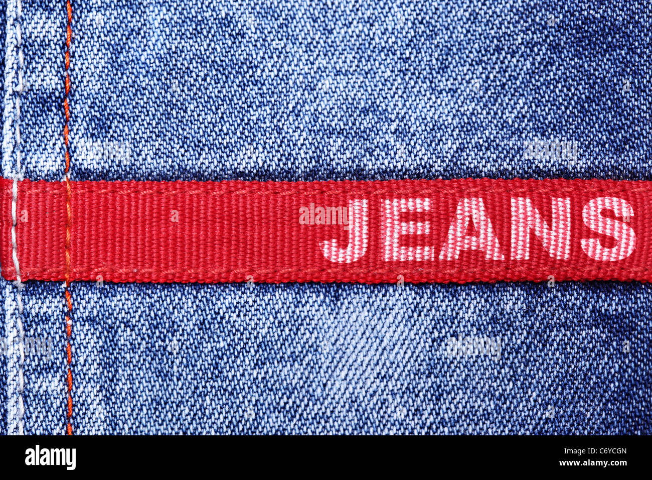 Blue jeans and red label with word 